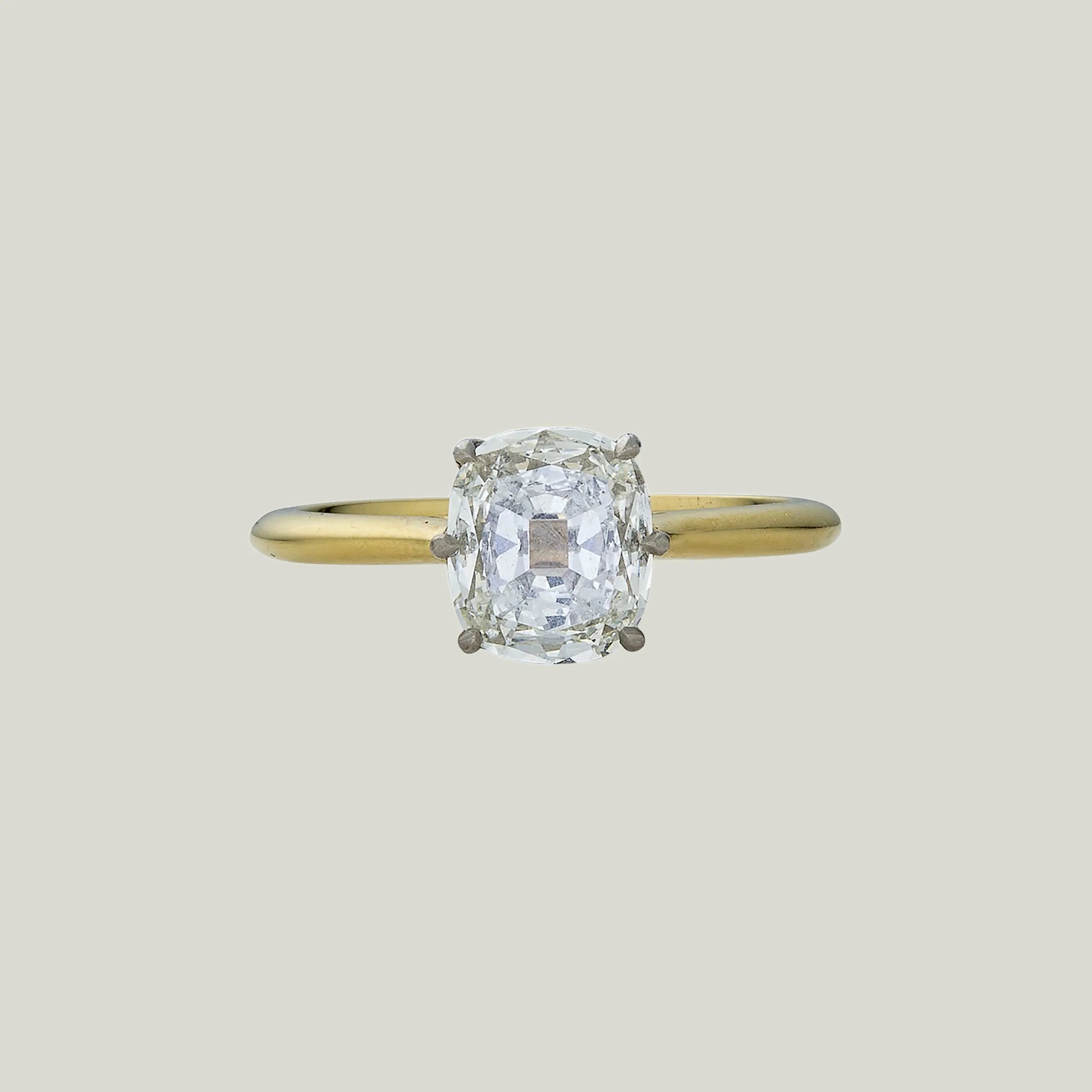 Contemporary Platinum and 18K Yellow Gold Cushion Cut Diamond Solitaire Ring
